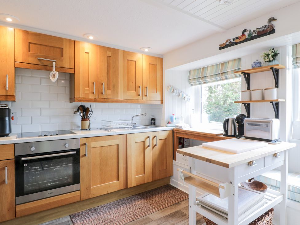 A kitchen with cabinets and a sink at The Barn in Rockcliffe