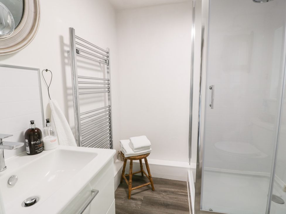 A bathroom with a shower and sink at The Barn in Rockcliffe