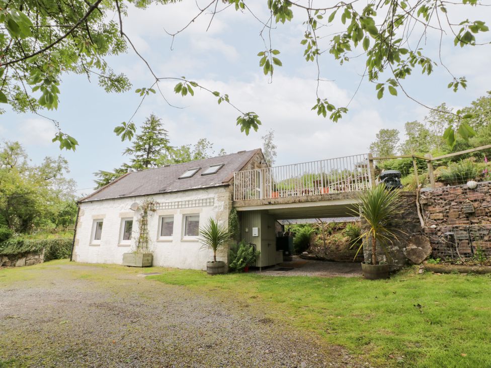 A house with a balcony and parking area at The Barn in Rockcliffe
