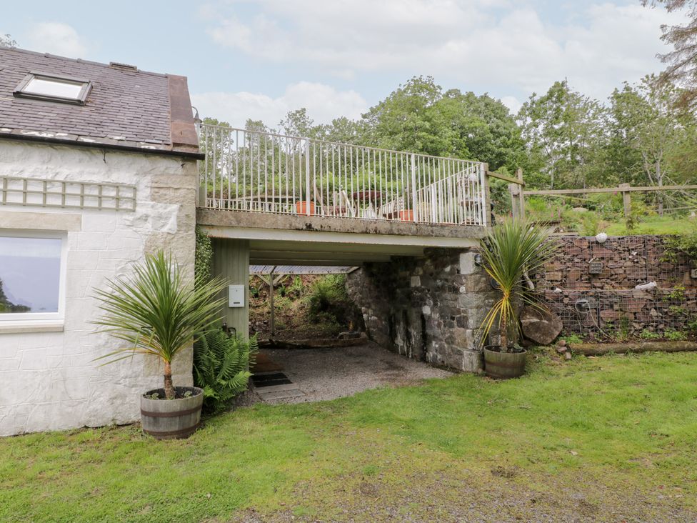 A house with a balcony and potted plants at The Barn in Rockcliffe
