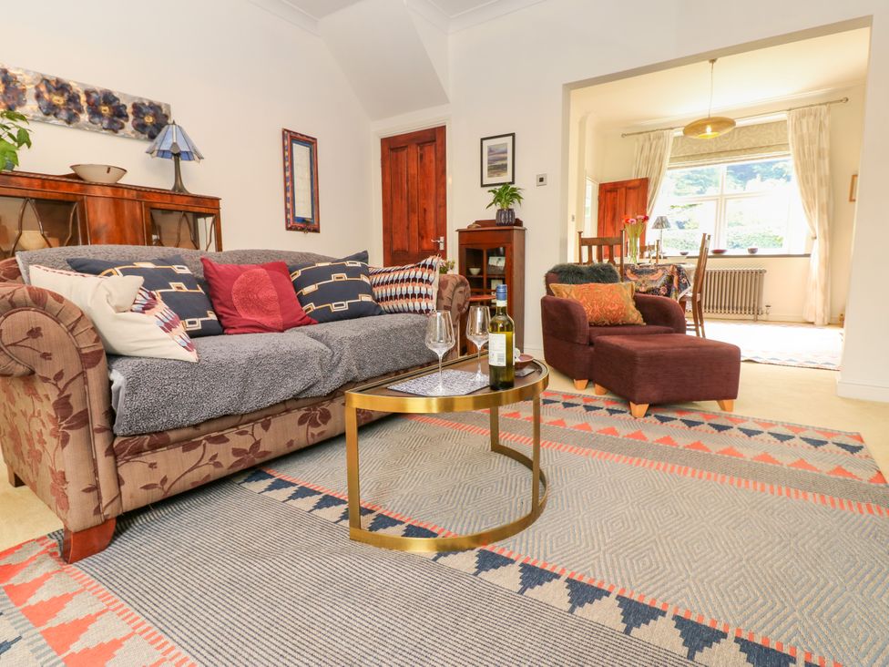 A living room with a sofa and coffee table at 4 Ford Street Lanchester