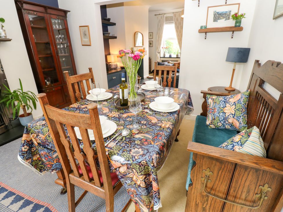 A dining room with a table set for dinner at 4 Ford Street in Lanchester