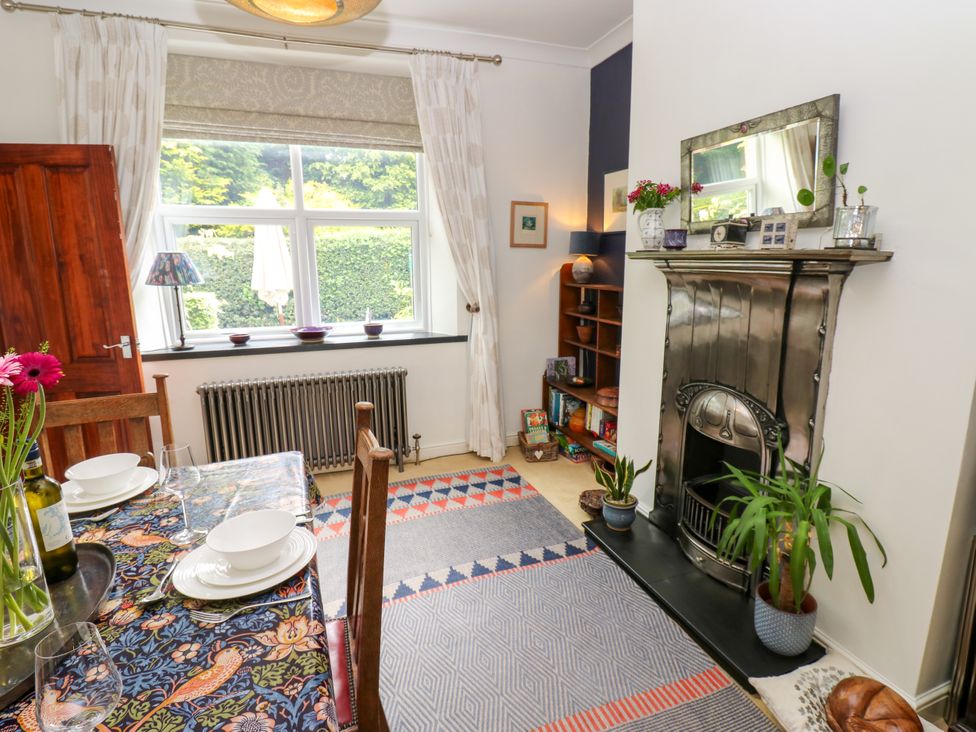 A dining room with a table set for a meal at 4 Ford Street, Lanchester