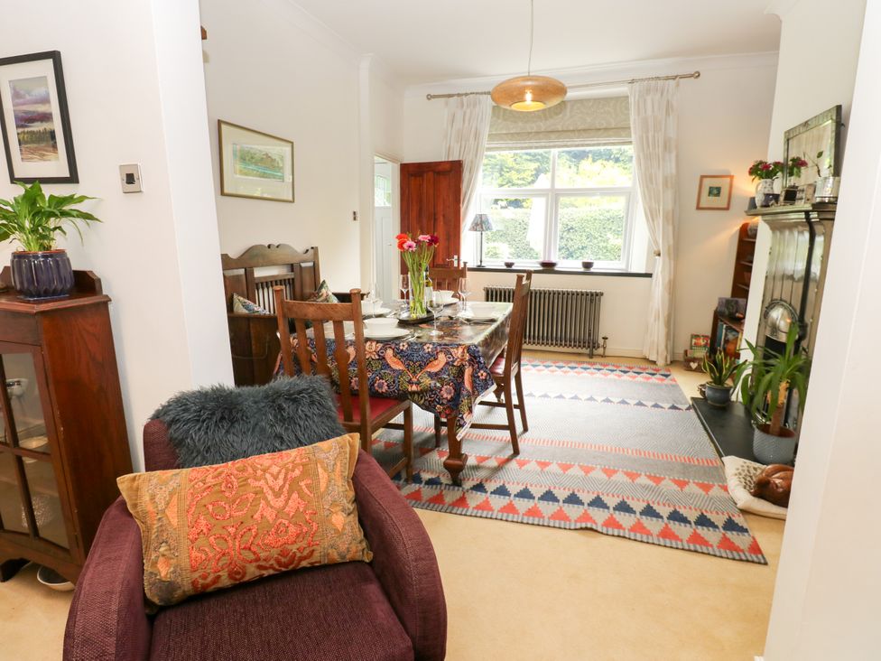A dining room with a table set and a radiator at 4 Ford Street Lanchester