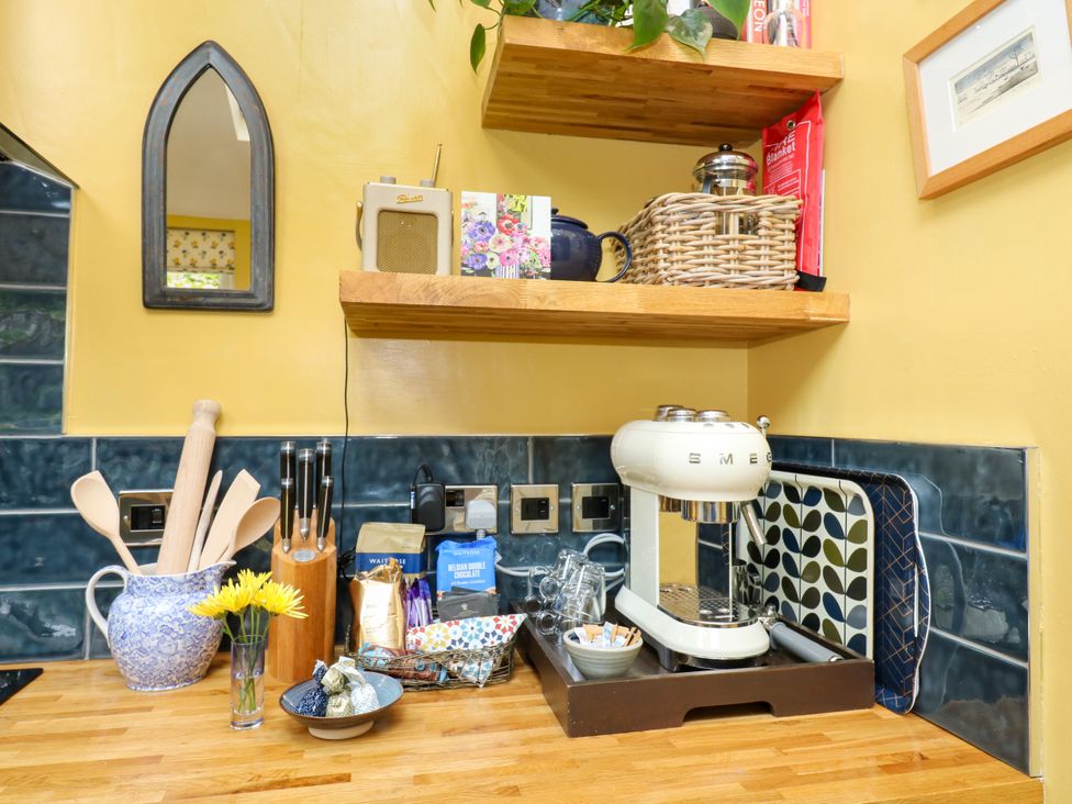 A kitchen countertop with coffee machine and utensils at 4 Ford Street Lanchester