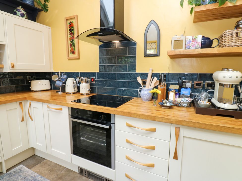 A kitchen with appliances and countertops at 4 Ford Street Lanchester