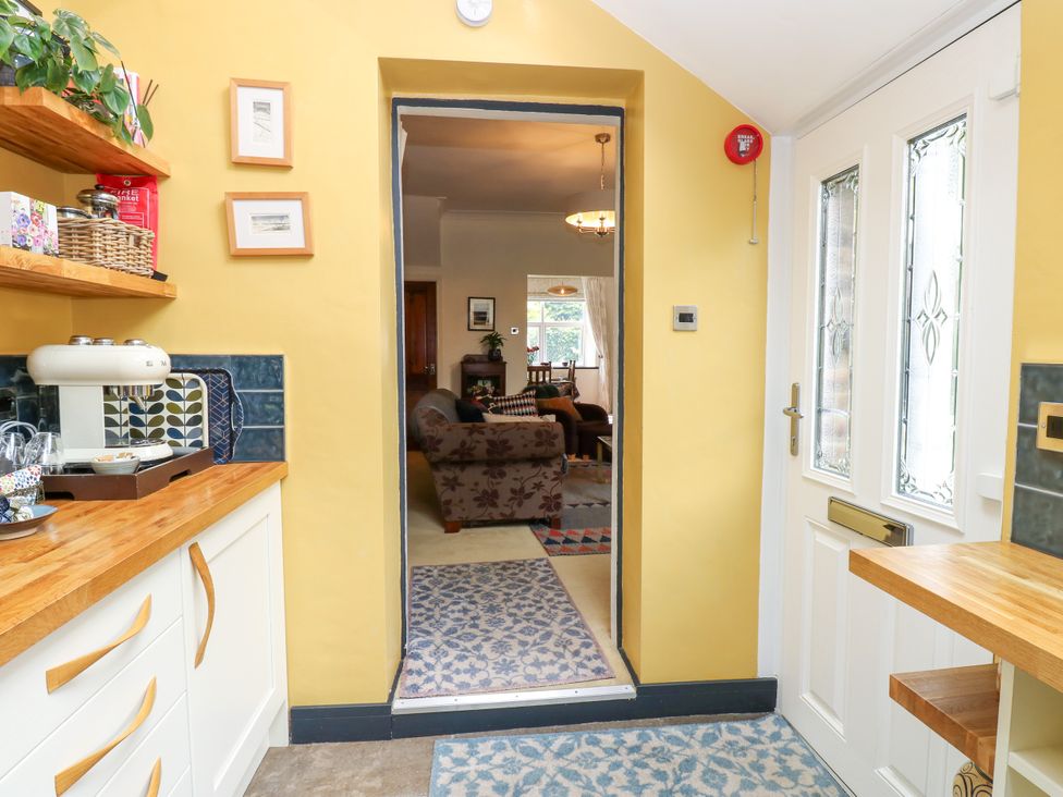 A kitchen with a door leading to another room at 4 Ford Street Lanchester