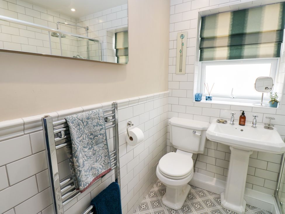 A bathroom with a toilet and sink at 4 Ford Street Lanchester