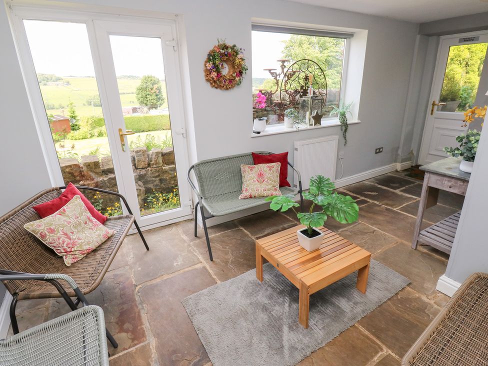 A snug with seating and a coffee table at The Thyme House in Haworth