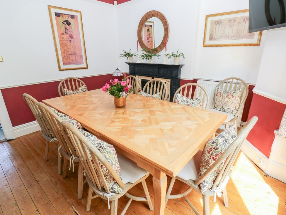 A dining room with a large table and chairs at The Thyme House in Haworth