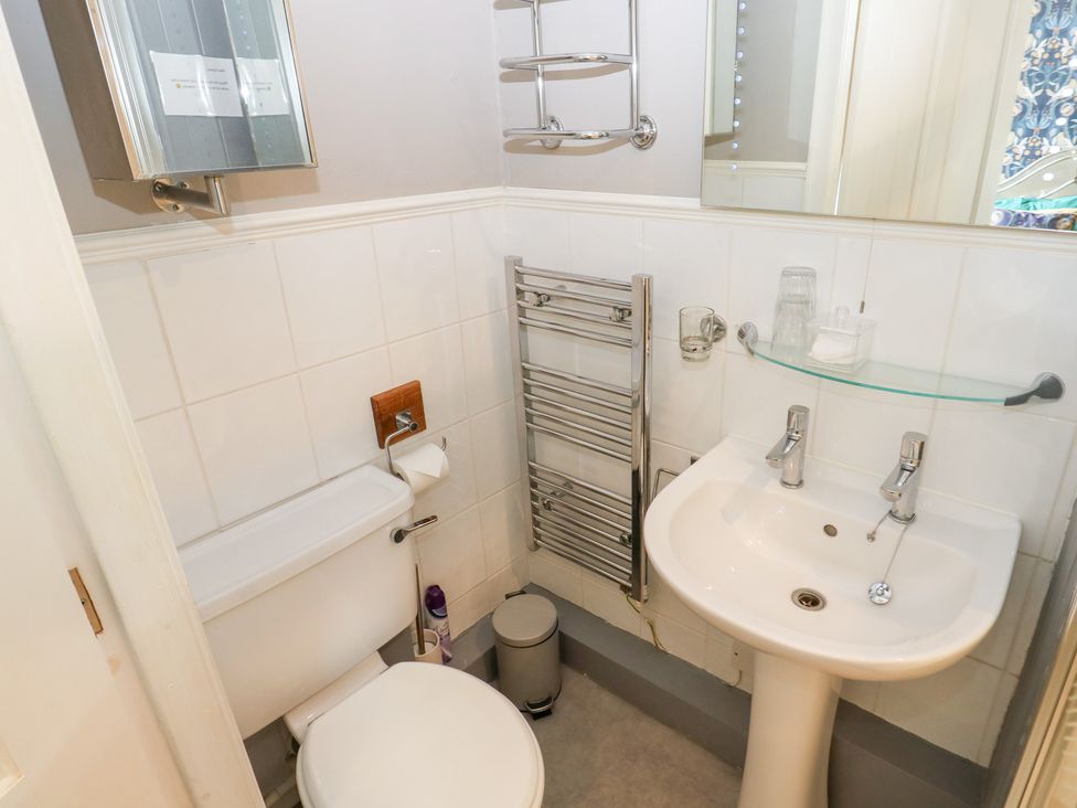 A bathroom with a toilet and sink at The Thyme House in Haworth
