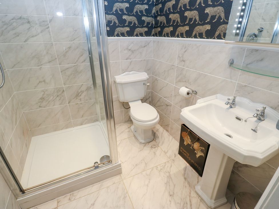 A bathroom with shower, toilet, and sink at The Thyme House in Haworth