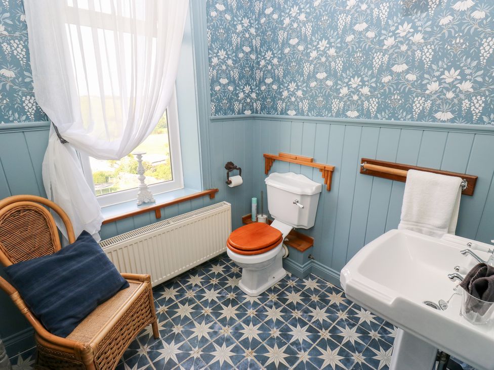 A bathroom with a toilet and sink at The Thyme House in Haworth