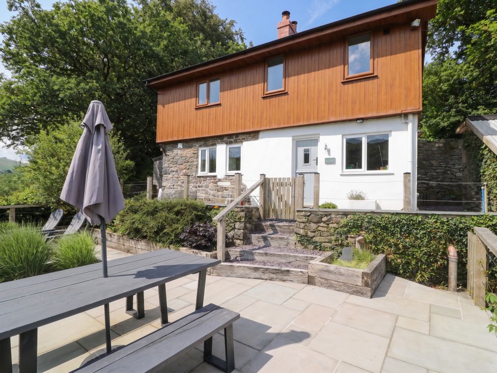 An outdoor view of a house with patio furniture at Pengeulan in Cemmaes