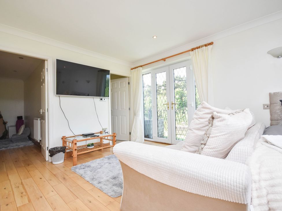 A living room with a sofa and television at Freshwinds in Market Drayton
