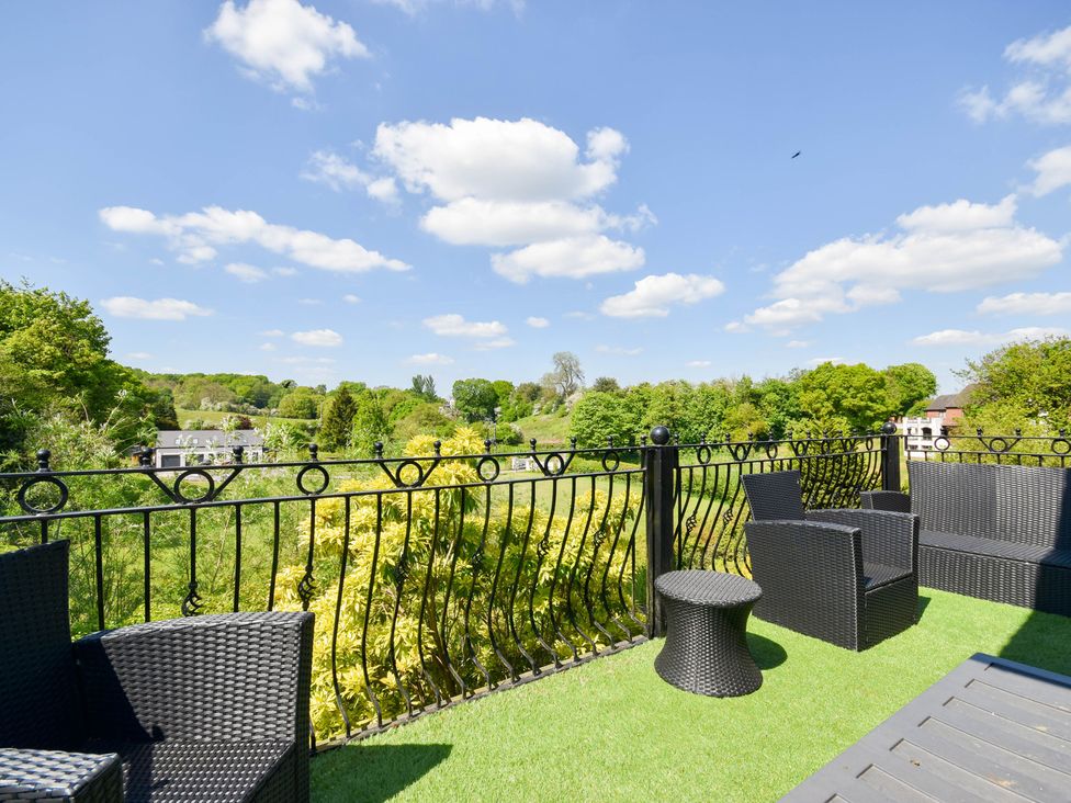 A balcony with seating and a view at Freshwinds in Market Drayton