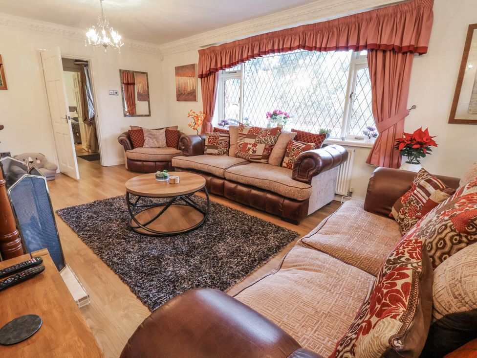 A living room with a sofa and coffee table at Freshwinds in Market Drayton