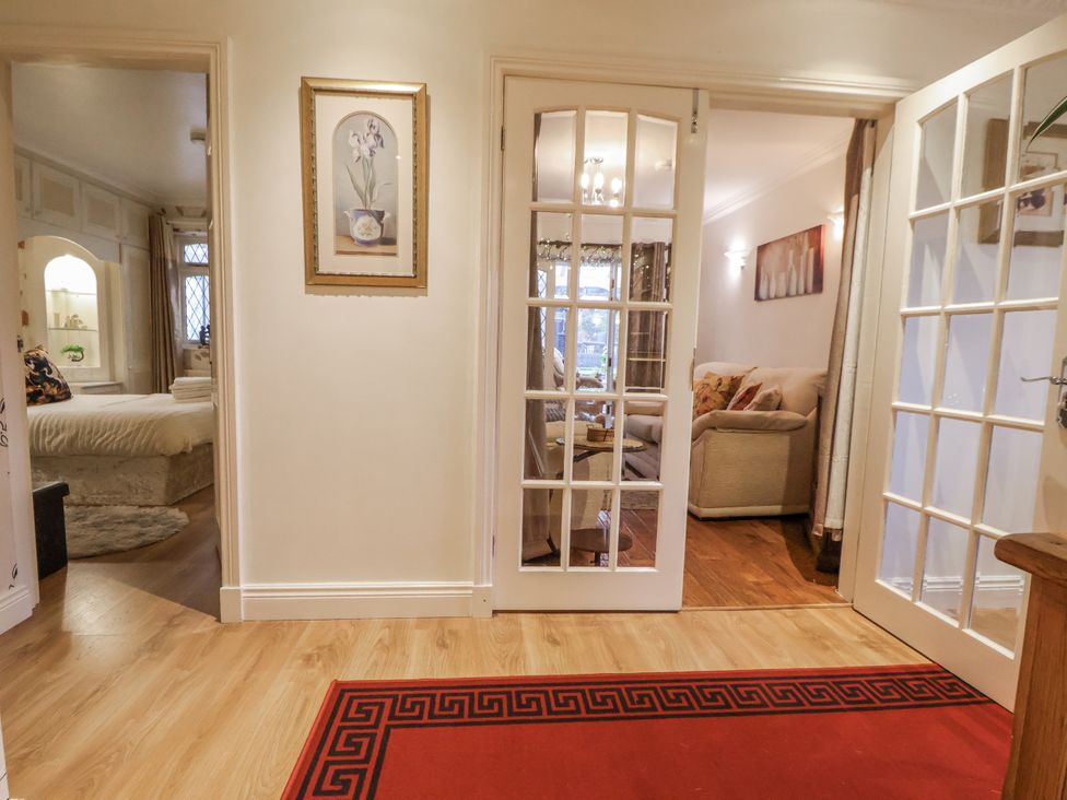 A hallway with doors leading to other rooms at Freshwinds in Market Drayton
