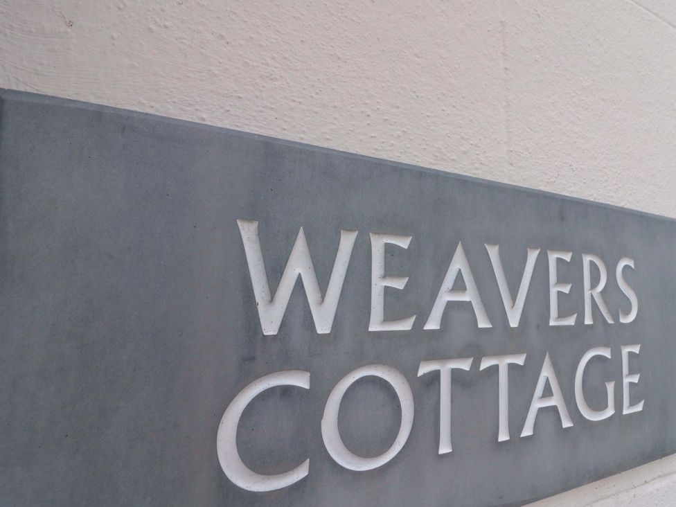 Sign that reads Weavers Cottage at Weavers Cottage in Carlton-in-Cleveland near Stokesley