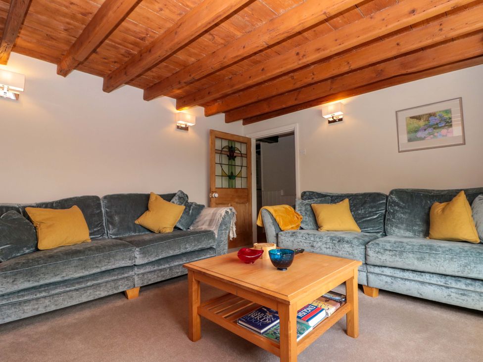 A living room with sofas and a coffee table at Weavers Cottage Carlton-in-Cleveland near Stokesley