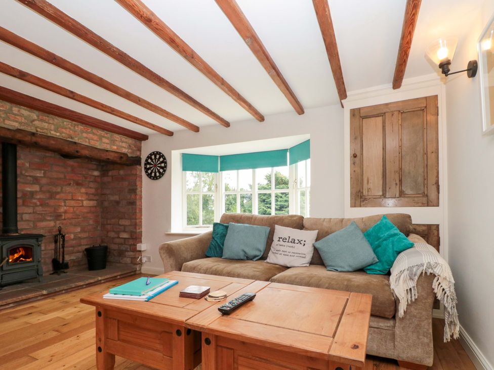 A living room with a sofa and coffee table at Weavers Cottage Carlton-in-Cleveland near Stokesley