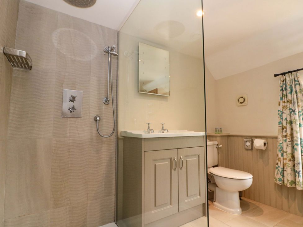 A bathroom with a shower and sink at Weavers Cottage in Carlton-in-Cleveland near Stokesley