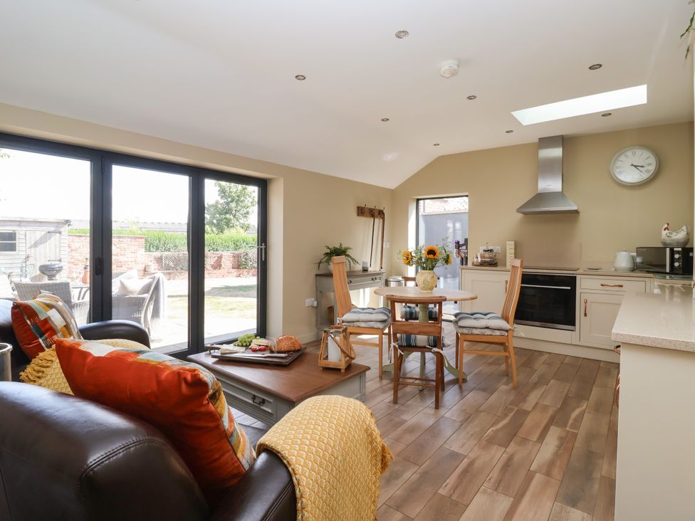 A kitchen with a table and chairs at 1 Church Barns Pocklington
