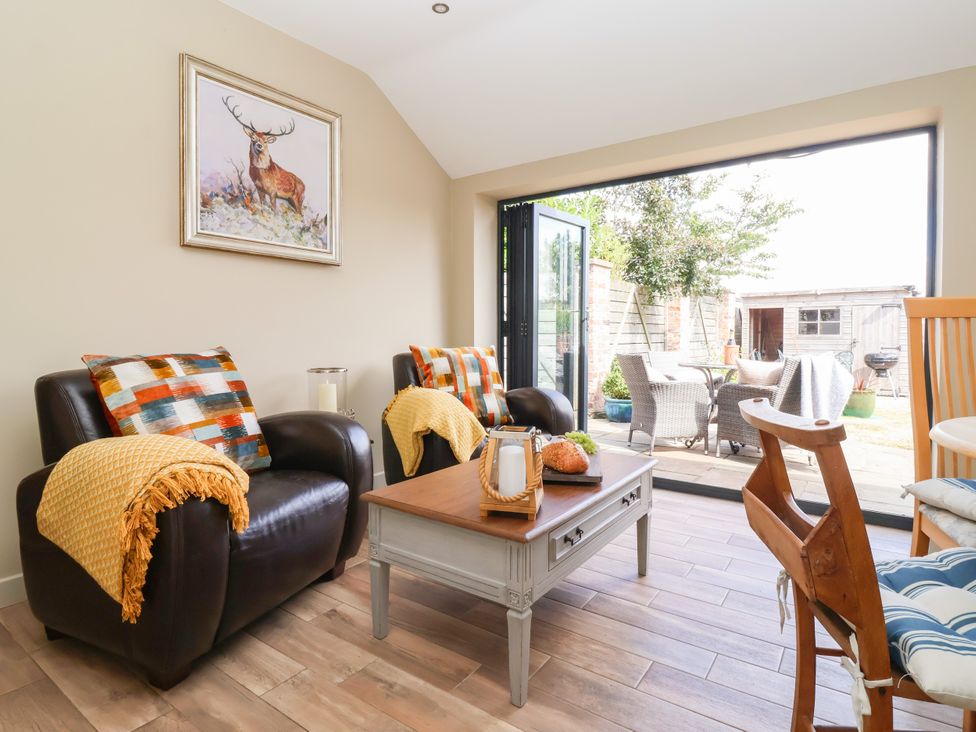 A living room with a sofa and table at 1 Church Barns in Pocklington