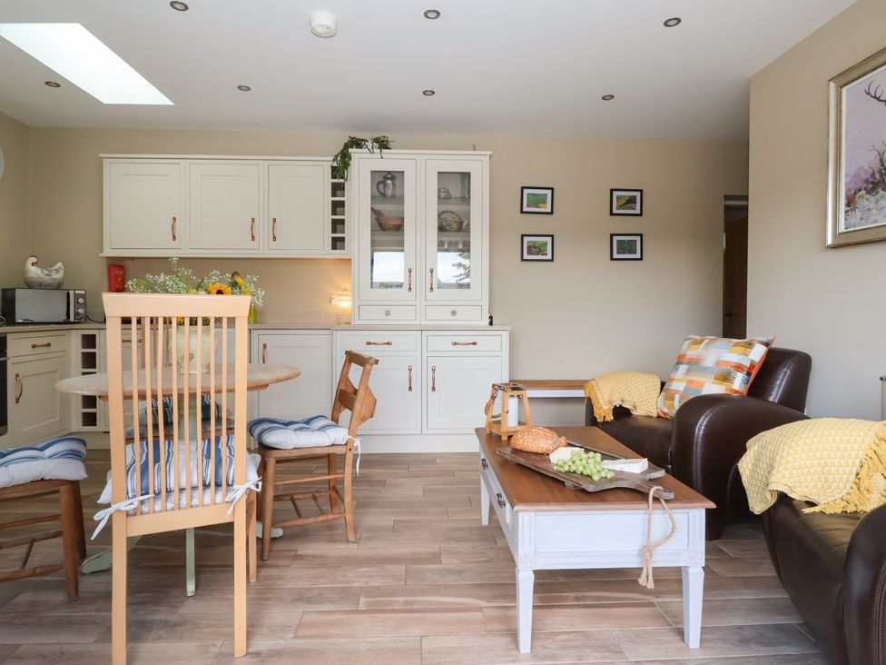 A kitchen with dining furniture and a couch at 1 Church Barns Pocklington