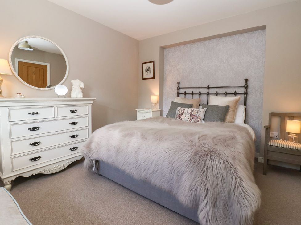 A bedroom with a bed and dresser at 1 Church Barns Pocklington
