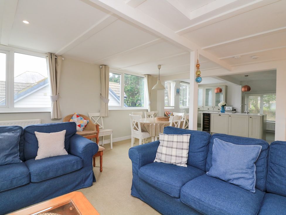 A dining room with a table and chairs at Lanapoule in Salcombe