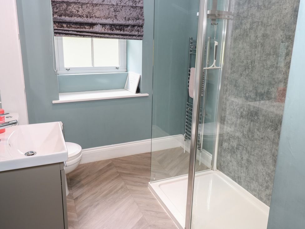 A bathroom with a shower and sink at White Lea in Reeth