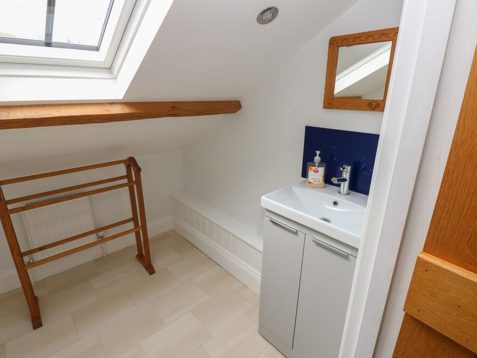 A bathroom with sink and towel rail at White Lea in Reeth