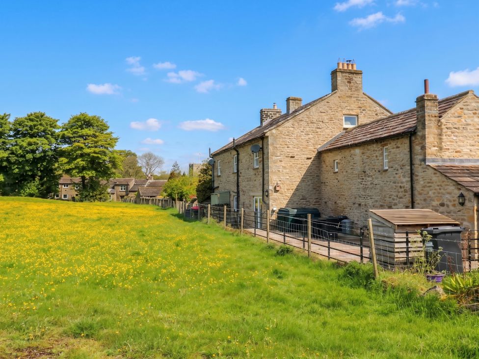 An outdoor view of houses and grassland at White Lea, Reeth