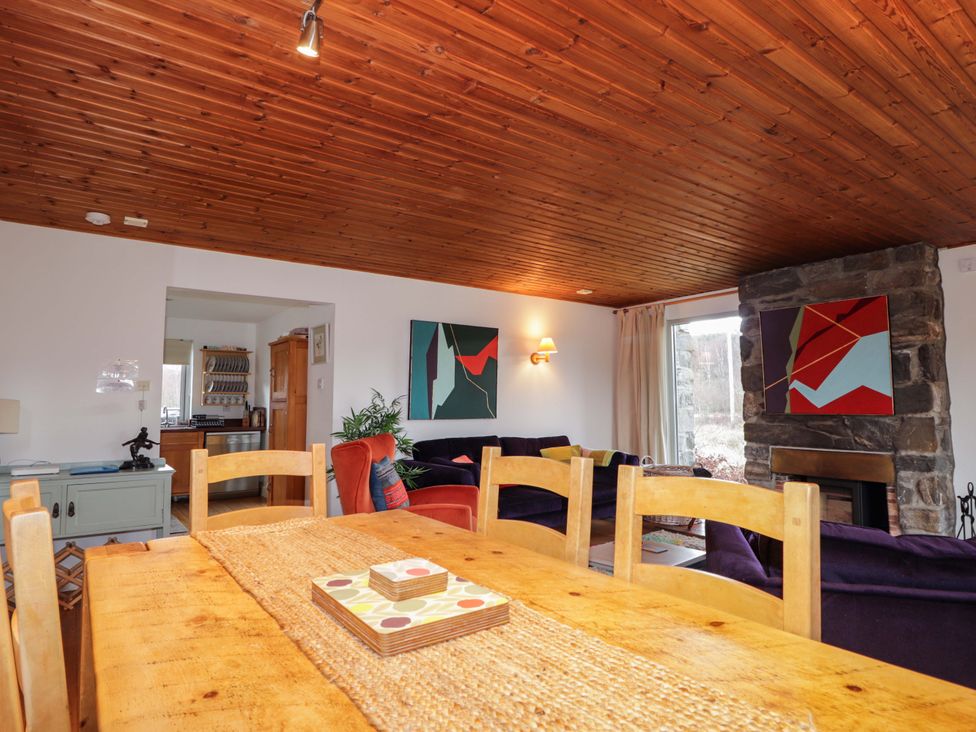 A dining room with wooden table and chairs at Inshcraig near Aviemore