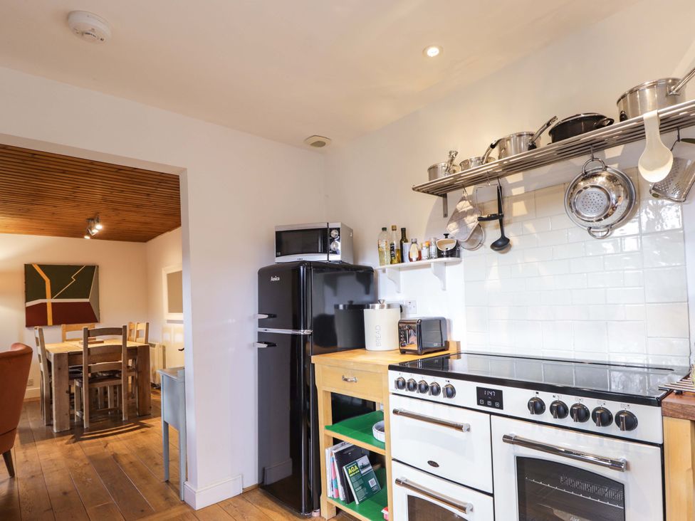 A kitchen with a refrigerator and stove at Inshcraig Kincraig near Aviemore