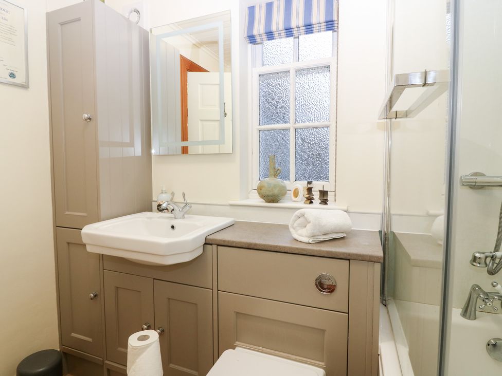 A bathroom with a sink and mirror at 1 The Cross in Dunkeld