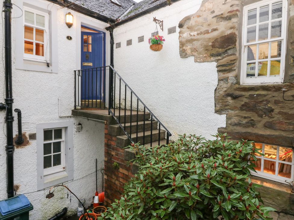 An outdoor area with stairs and a blue door at 1 The Cross Dunkeld