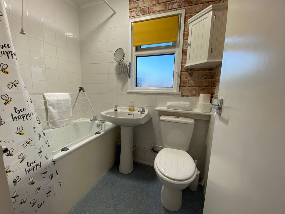 A bathroom with a bathtub and sink at 246 California Road, California, Norfolk