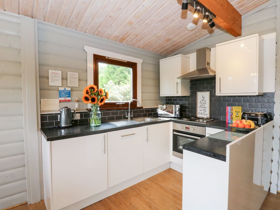 A kitchen with a sink and cabinets at Mountain View in Rhayader