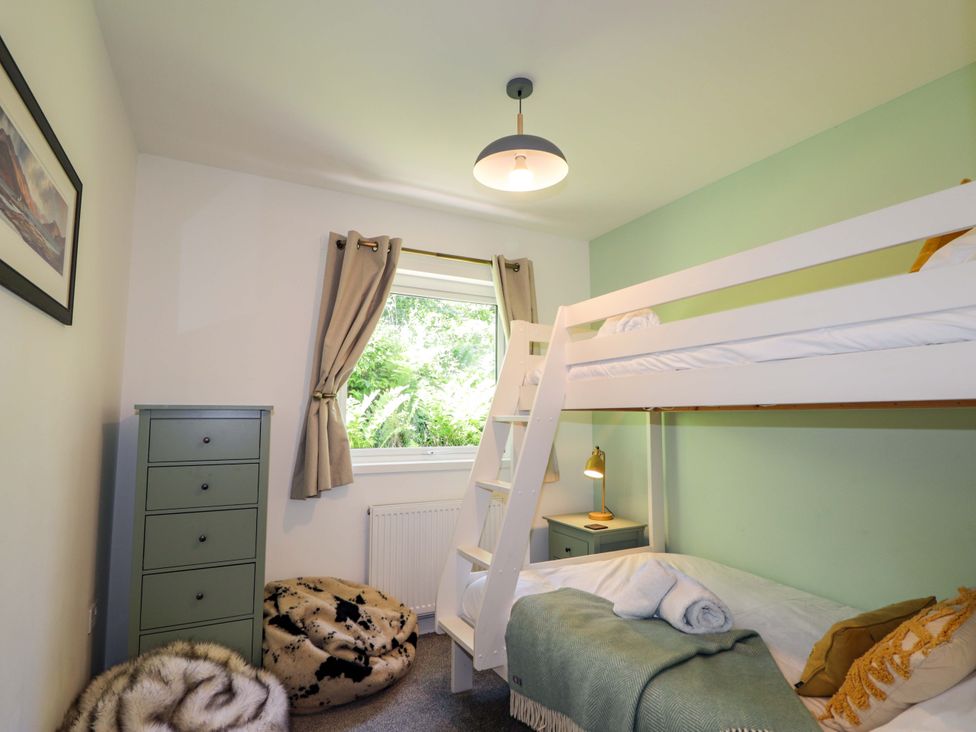 A bedroom with bunk bed and furnishings at The Lookout in Saasaig near Broadford