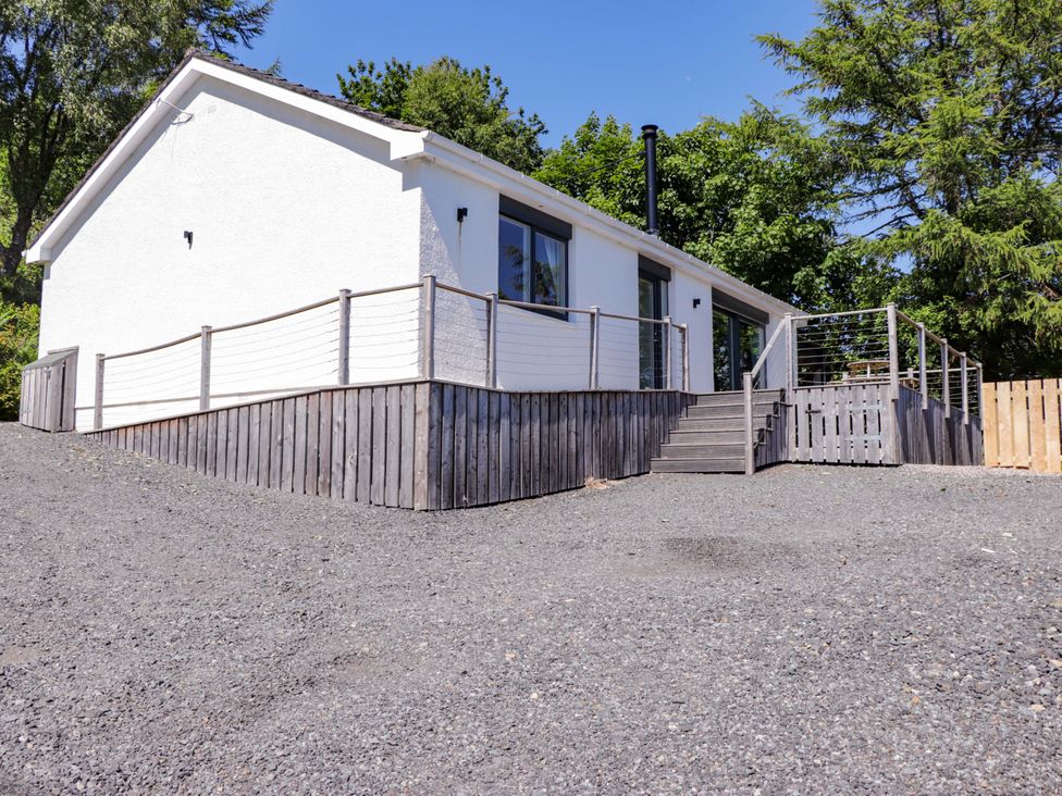 A house with a deck and stairs at The Lookout Saasaig near Broadford