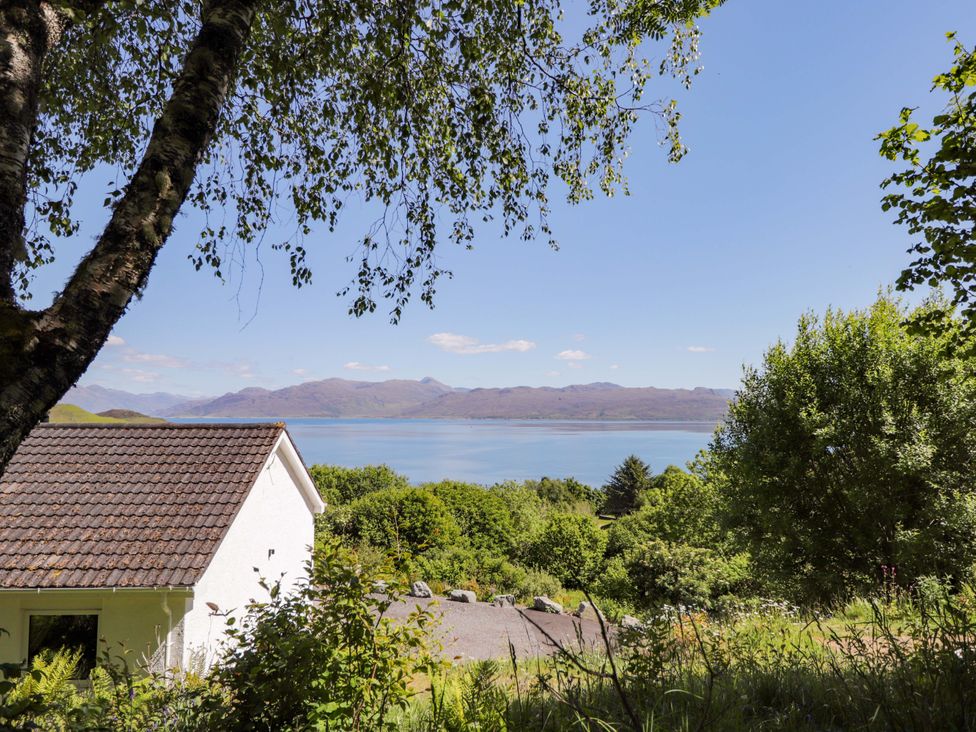 A house with trees and water view at The Lookout in Saasaig near Broadford