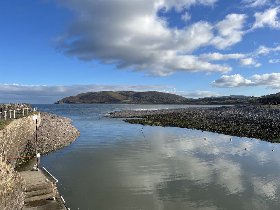 A coastal view with rocks and hills at 3 Lowerbourne Terrace Porlock