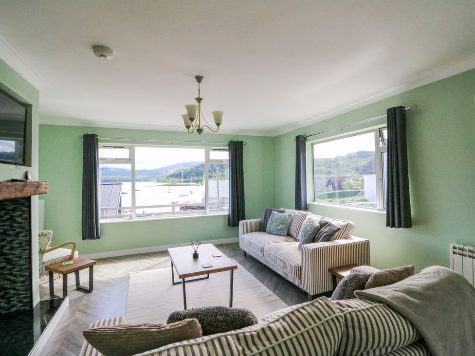 A living room with a sofa and coffee table at Am Bruaich in Tayvallich