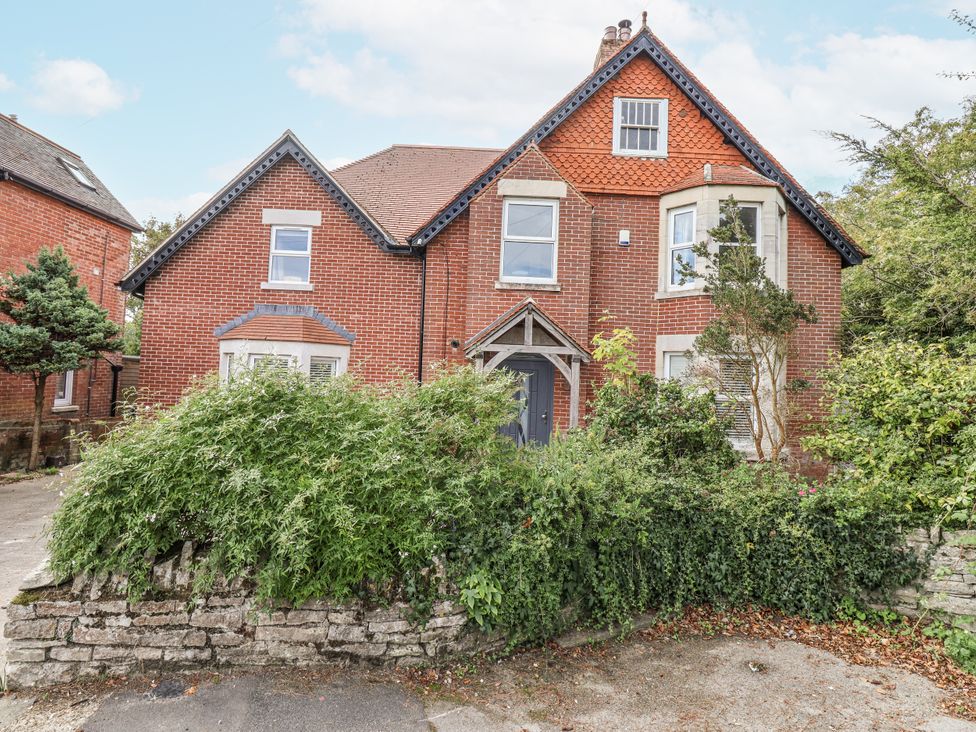 A building with a front door and windows at 49 Ulwell Road in Swanage