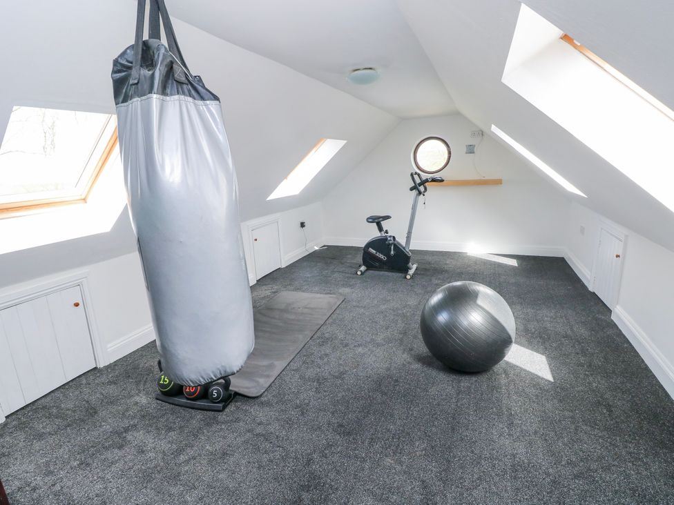 A gym with a punching bag and exercise equipment at Mountain Farm in Broad Haven