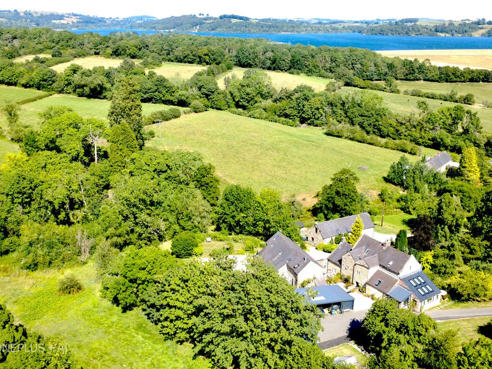 An aerial view of fields and buildings at Green Farm Cottage in Hognaston near Carsington Water