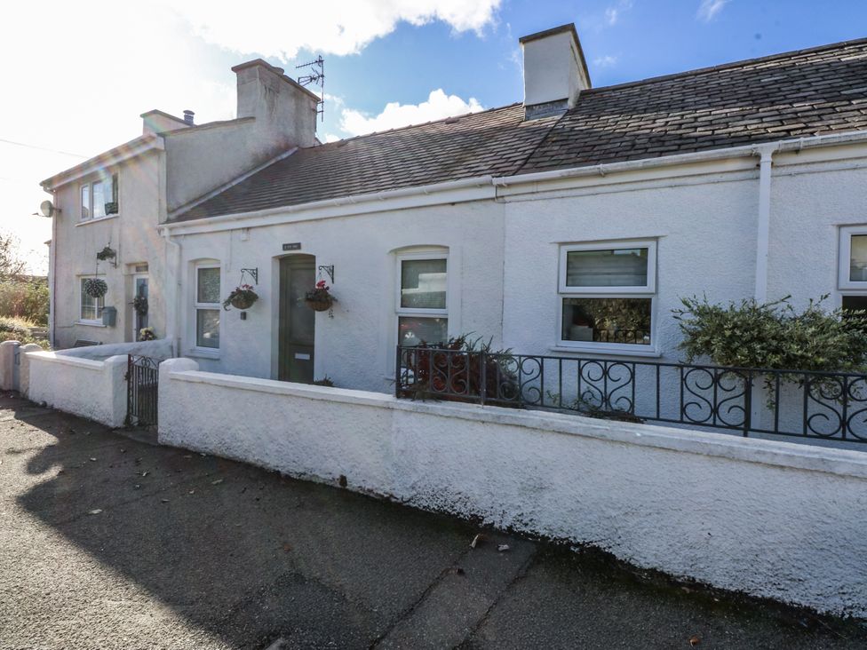 A house exterior with windows and a door at 3 Tyn Giat in Penysarn near Amlwch