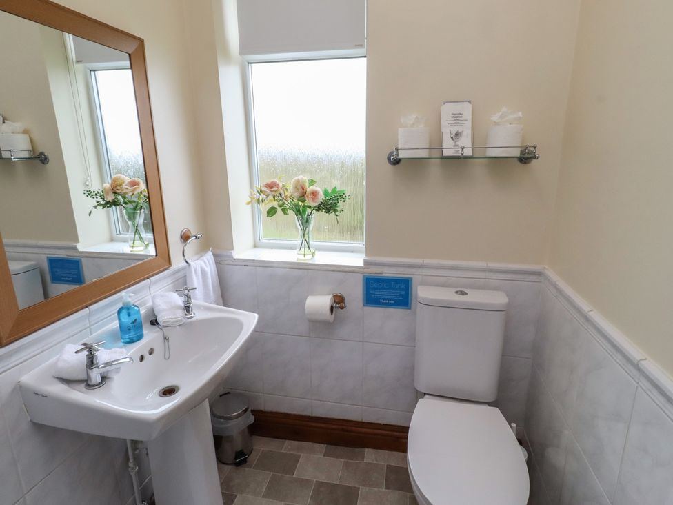 A bathroom with a sink and toilet at The Retreat in Embleton